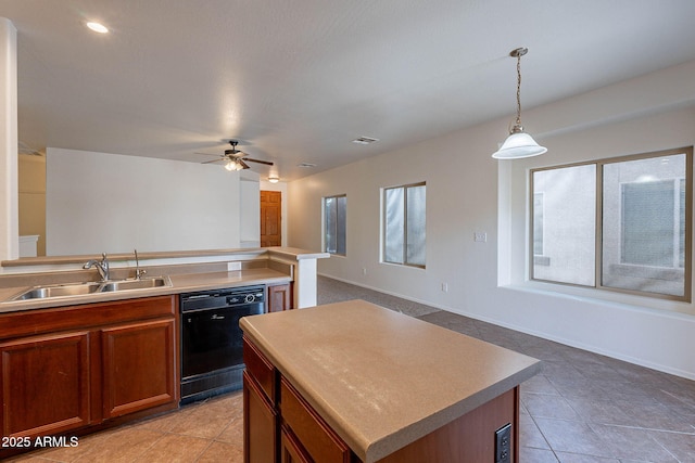 kitchen with a sink, black dishwasher, hanging light fixtures, open floor plan, and brown cabinetry