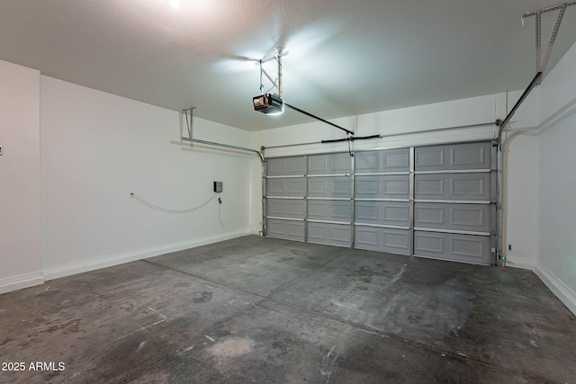 garage with baseboards and a garage door opener