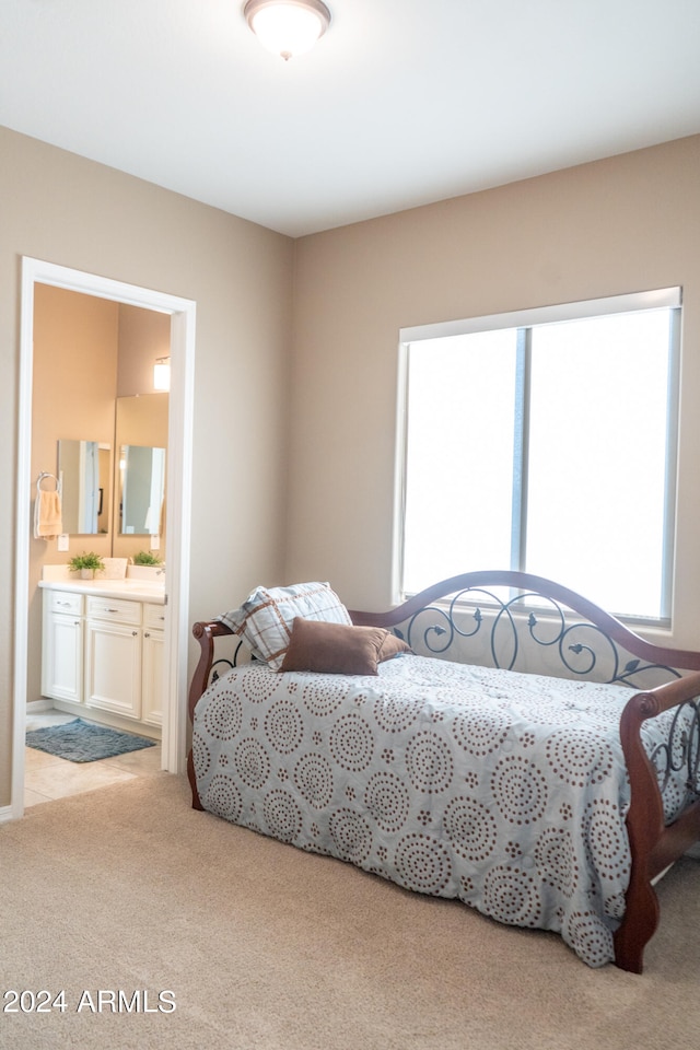 carpeted bedroom with connected bathroom