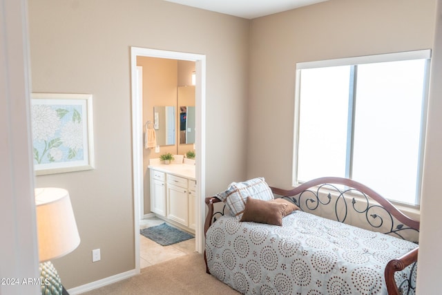 27002 W Oraibi Dr, Buckeye, AZ 85396 - bedroom with baseboards, light carpet, connected bathroom, and multiple windows