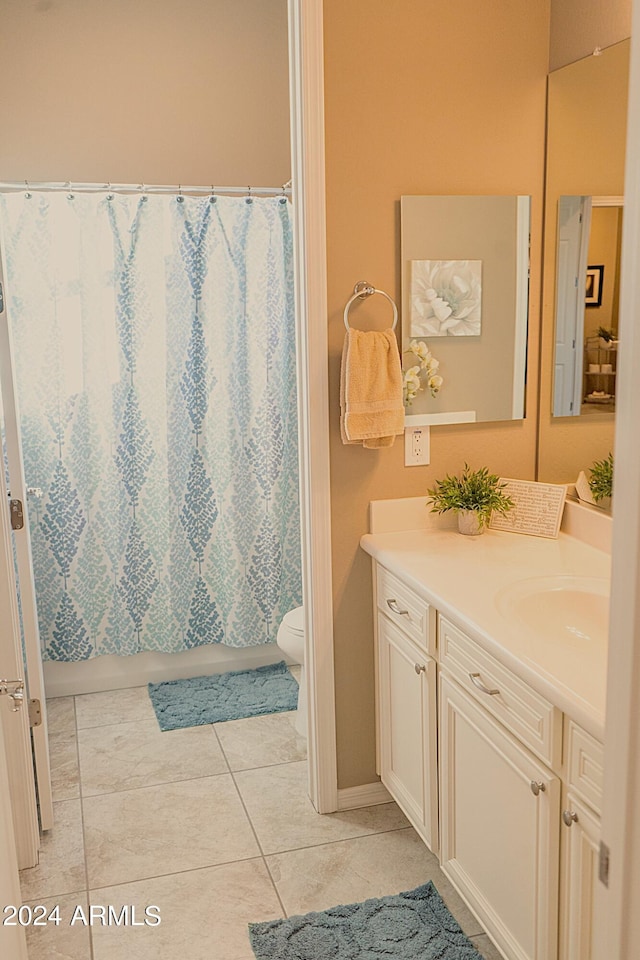 full bathroom with tile patterned floors, vanity, shower / bath combination with curtain, and toilet