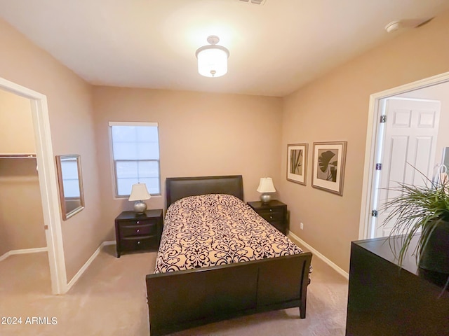 27002 W Oraibi Dr, Buckeye, AZ 85396 - carpeted bedroom featuring a spacious closet and baseboards