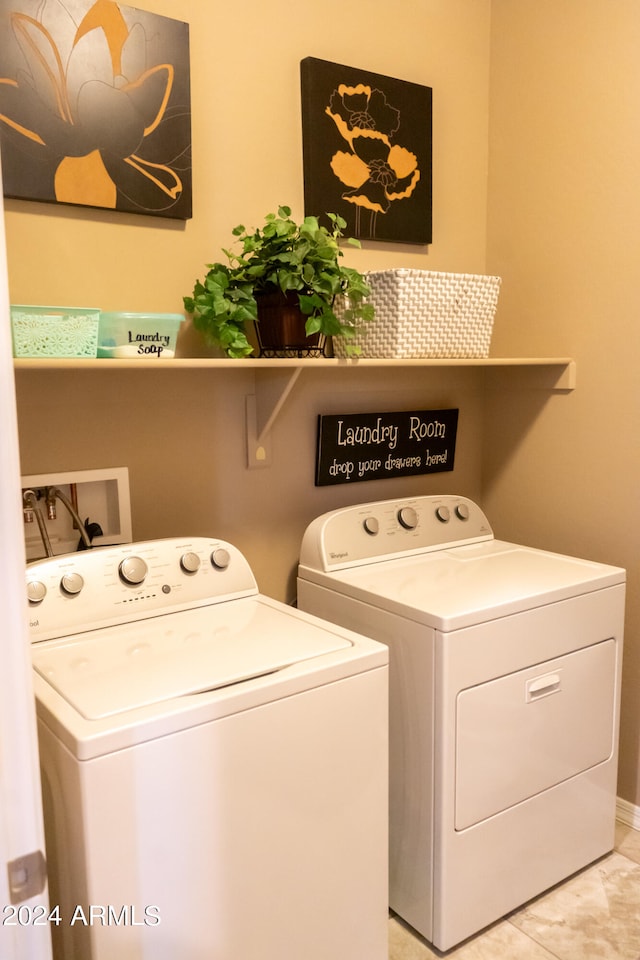 washroom featuring washer and clothes dryer