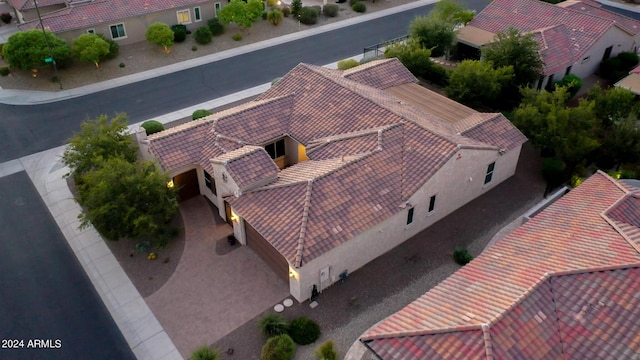 27002 W Oraibi Dr, Buckeye, AZ 85396 - mediterranean / spanish-style house featuring driveway, stucco siding, an attached garage, and a tile roof