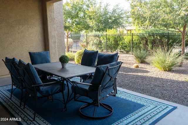 27002 W Oraibi Dr, Buckeye, AZ 85396 - kitchen with a sink, light stone counters, hanging light fixtures, dishwasher, and open floor plan