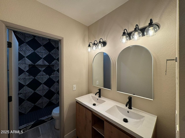 bathroom featuring walk in shower, vanity, toilet, and hardwood / wood-style flooring