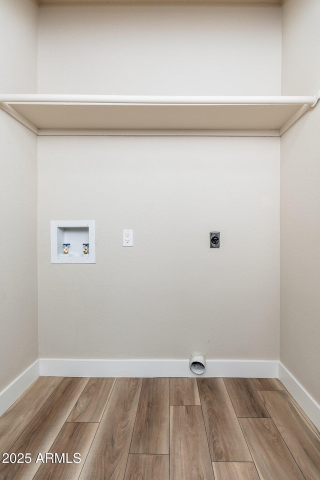 laundry area with electric dryer hookup, hardwood / wood-style floors, and hookup for a washing machine