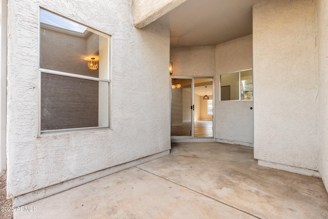 doorway to property with a patio