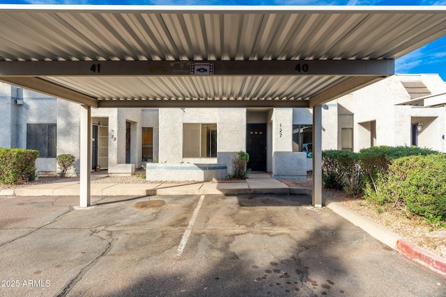 view of patio / terrace with a carport