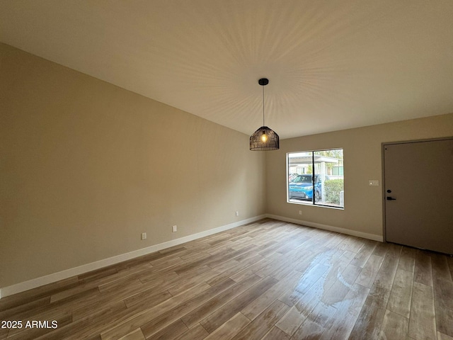 unfurnished room with hardwood / wood-style floors