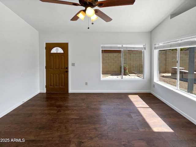 entrance foyer with lofted ceiling, dark wood-type flooring, and ceiling fan