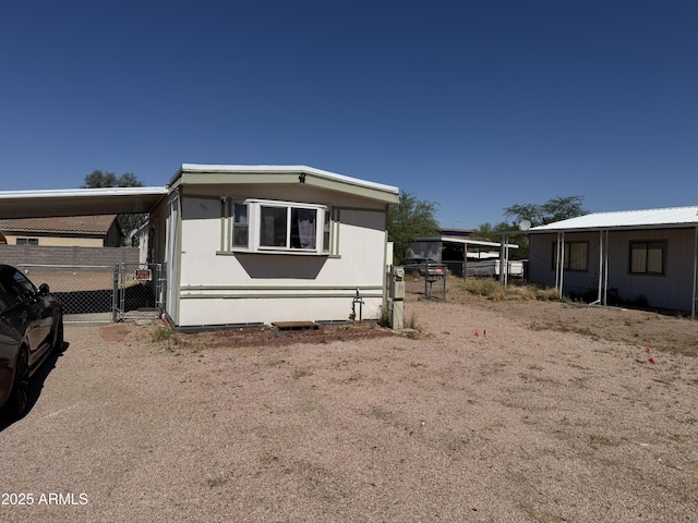1776 S Lawson Dr, Apache Junction, AZ 85120 - view of front of house featuring a carport