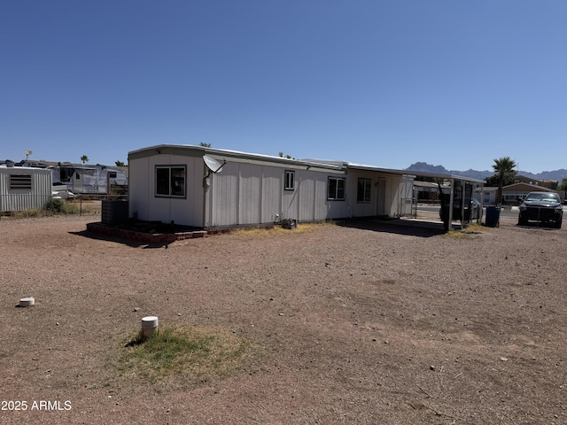 1776 S Lawson Dr, Apache Junction, AZ 85120 - back of house with a mountain view and a carport