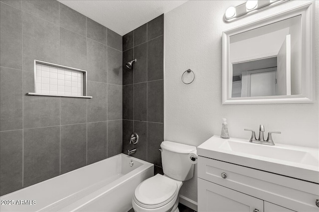 full bathroom with washtub / shower combination, toilet, vanity, a textured wall, and a textured ceiling