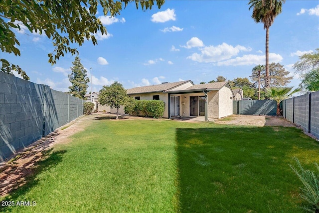 view of yard with a fenced backyard