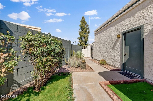 view of yard with a patio and fence