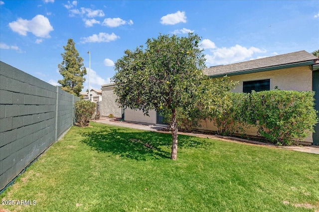 view of yard with a fenced backyard