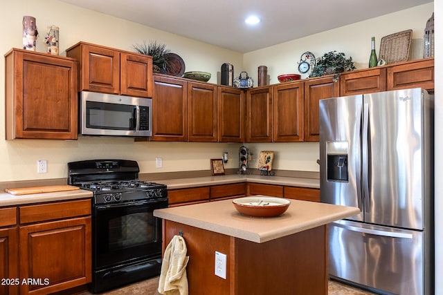 kitchen featuring a kitchen island, stainless steel appliances, light countertops, and recessed lighting