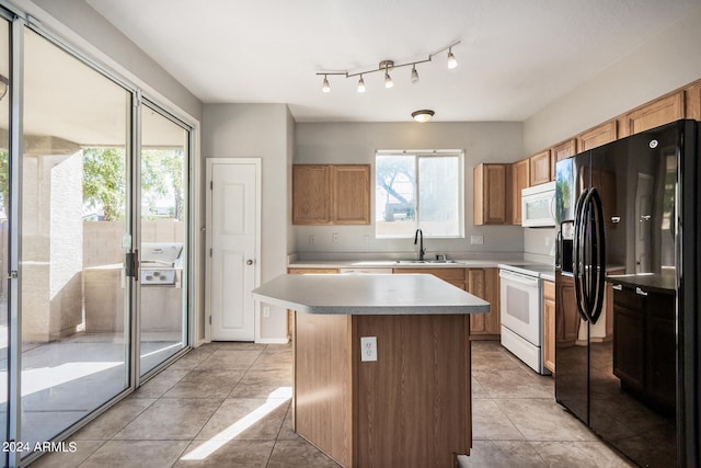 kitchen with a center island, sink, light tile patterned floors, and white appliances