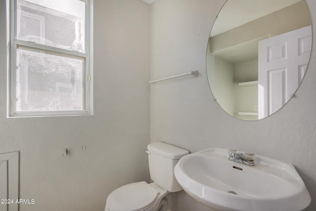 bathroom with toilet and sink