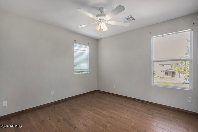 unfurnished room featuring ceiling fan and hardwood / wood-style flooring