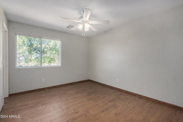 unfurnished room with ceiling fan and light hardwood / wood-style flooring