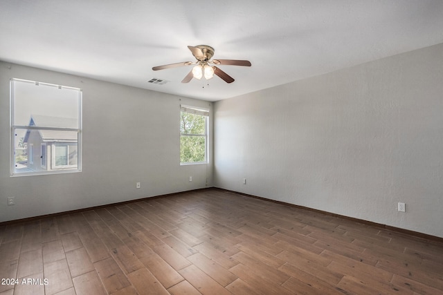 empty room featuring hardwood / wood-style floors and ceiling fan