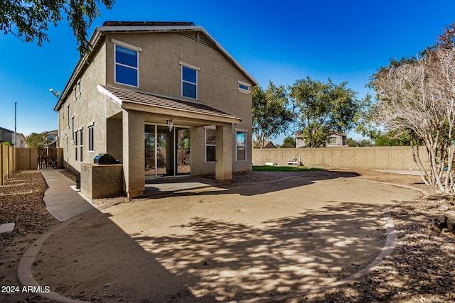 rear view of house featuring a patio