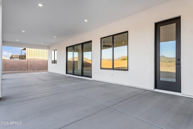 view of patio / terrace featuring fence