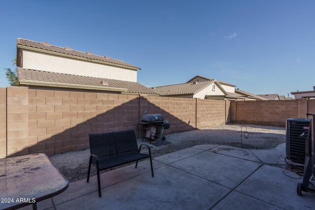 view of patio / terrace featuring central air condition unit and area for grilling