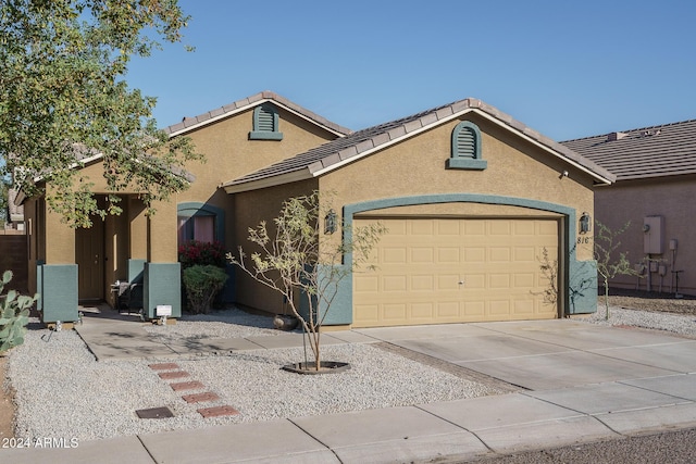 ranch-style home featuring a garage