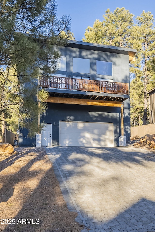 rear view of property featuring a garage