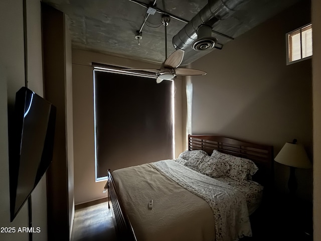 bedroom featuring wood finished floors