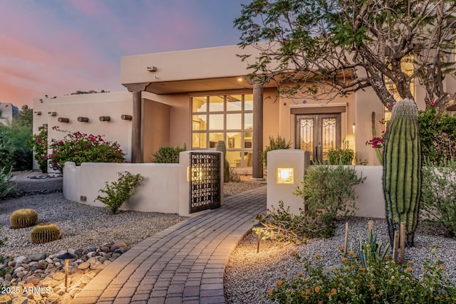 25825 N 106th Way, Scottsdale, AZ 85255 - view of front of property featuring a gate, a fenced front yard, stucco siding, and french doors