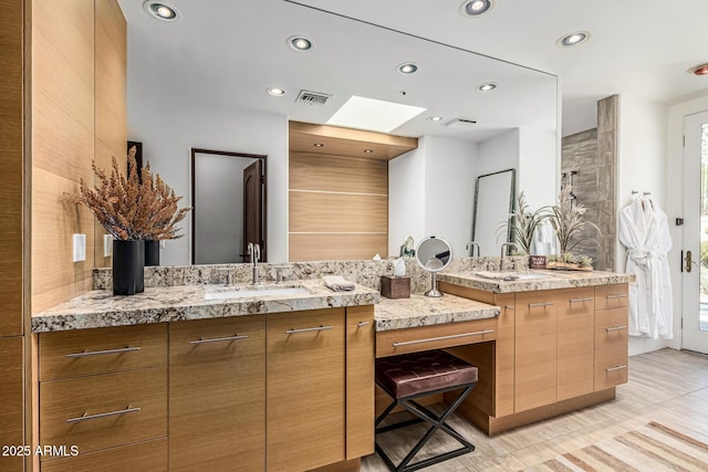25825 N 106th Way, Scottsdale, AZ 85255 - bathroom featuring recessed lighting, two vanities, and a skylight