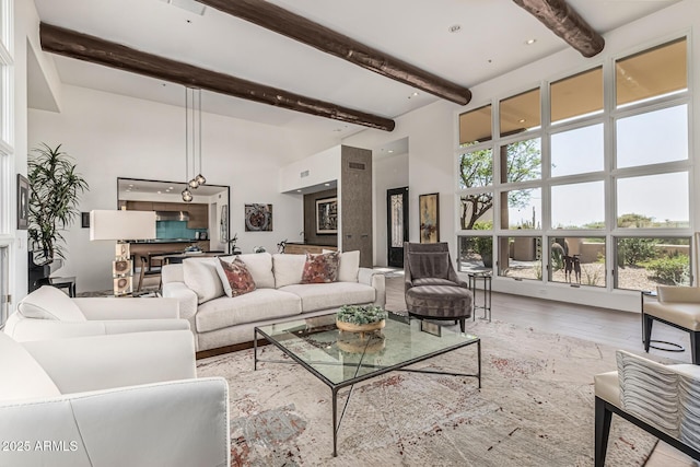 25825 N 106th Way, Scottsdale, AZ 85255 - living room featuring a high ceiling, beamed ceiling, and wood finished floors
