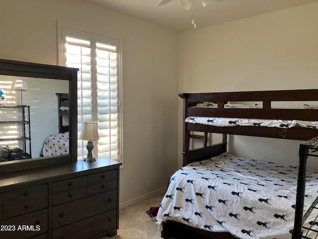 bedroom featuring ceiling fan and light colored carpet