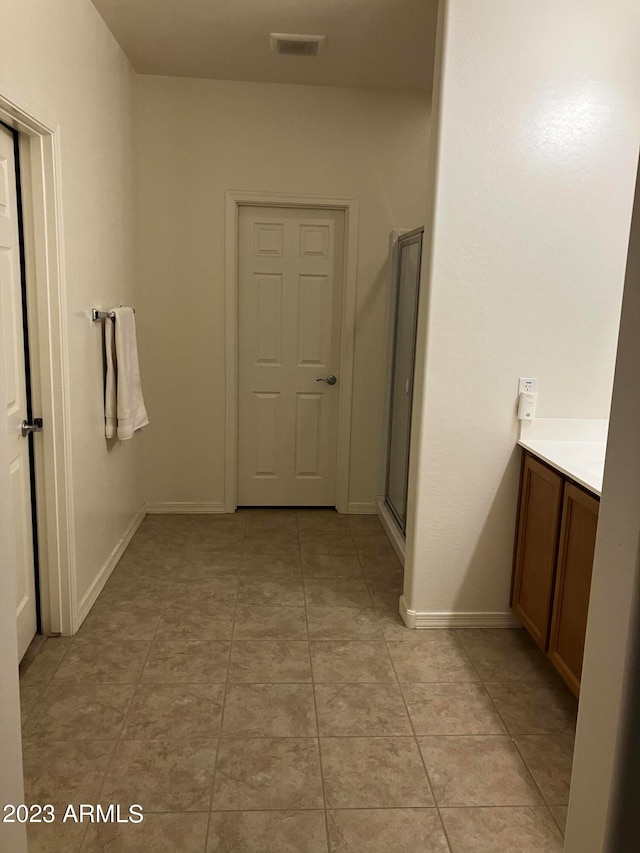 interior space featuring light tile flooring