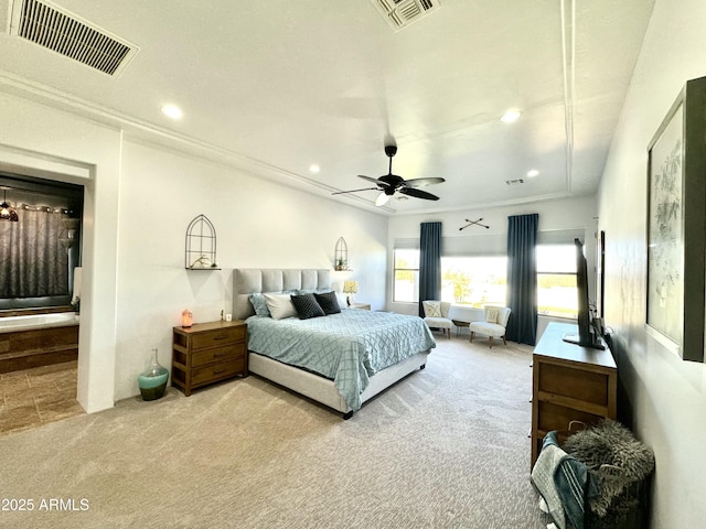 carpeted bedroom featuring ensuite bath, visible vents, ceiling fan, and recessed lighting