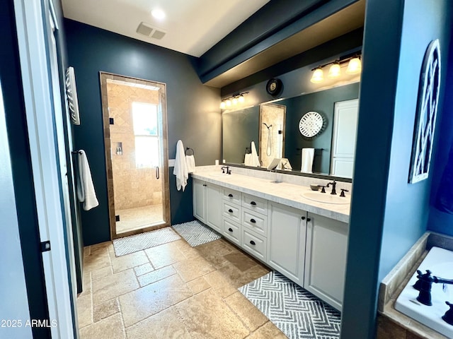 full bathroom with a shower stall, a sink, visible vents, and stone tile floors