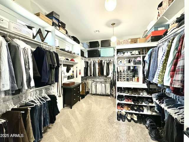 spacious closet with carpet floors and visible vents