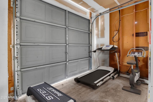 workout area with a garage