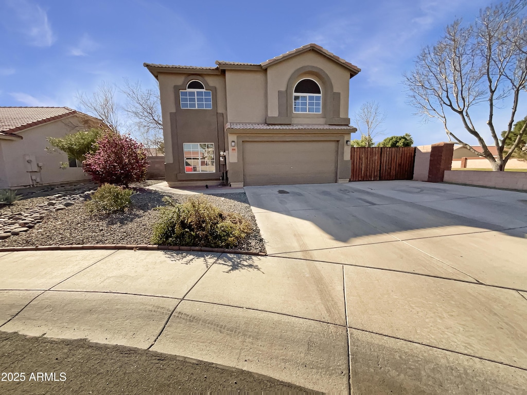 mediterranean / spanish-style home featuring a garage