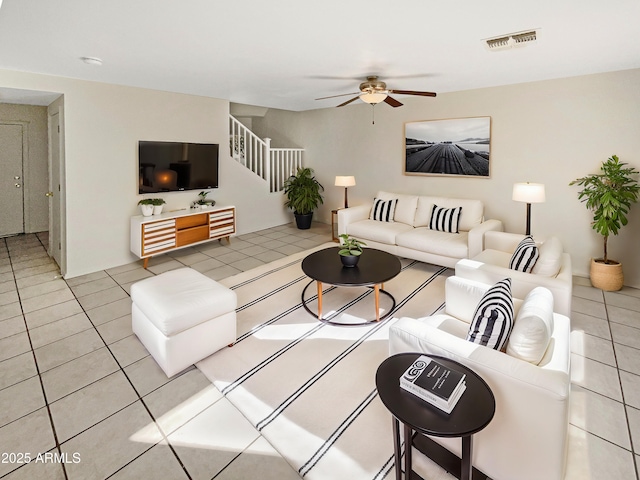 living room with light tile patterned floors and ceiling fan