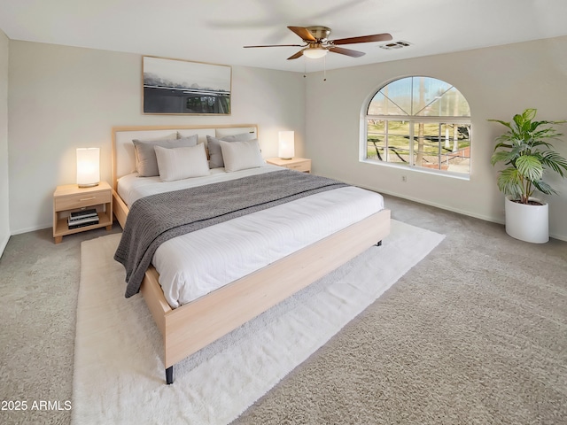 bedroom with light colored carpet and ceiling fan