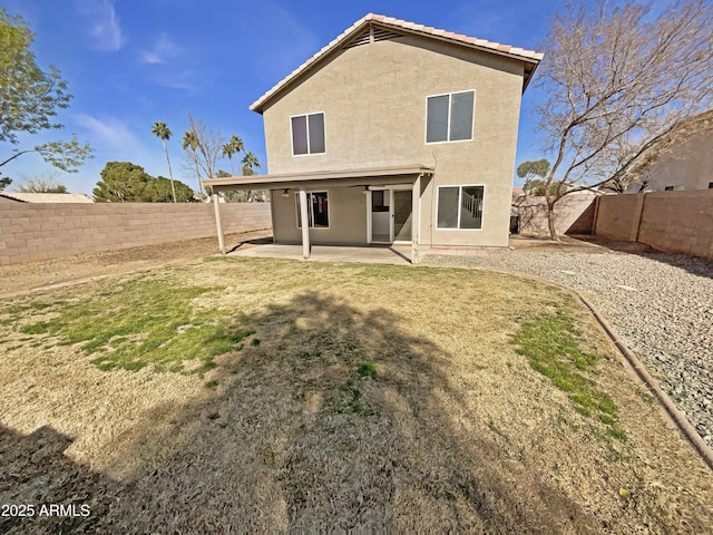 back of house featuring a patio area