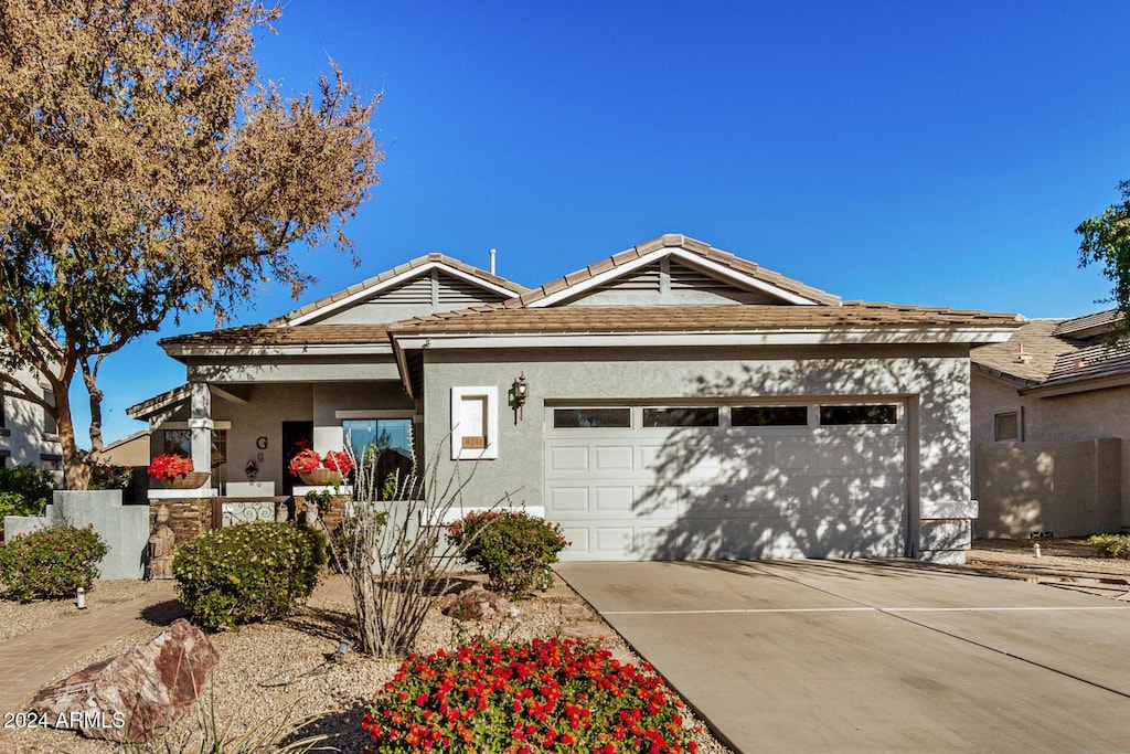 single story home featuring a garage