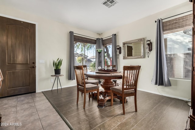 dining space with hardwood / wood-style flooring