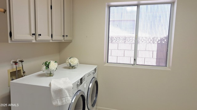 washroom with washing machine and dryer