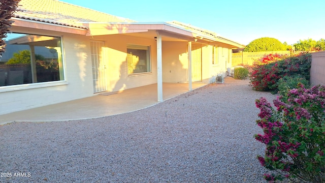 view of side of property featuring a patio